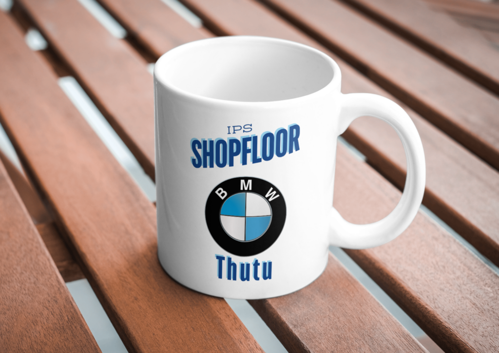 A ceramic mug branded with a logo and name, showcasing corporate branding in pretoria